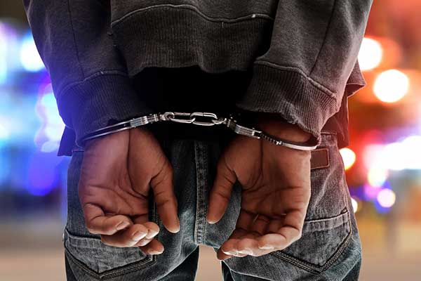 Man in handcuffs from a crime